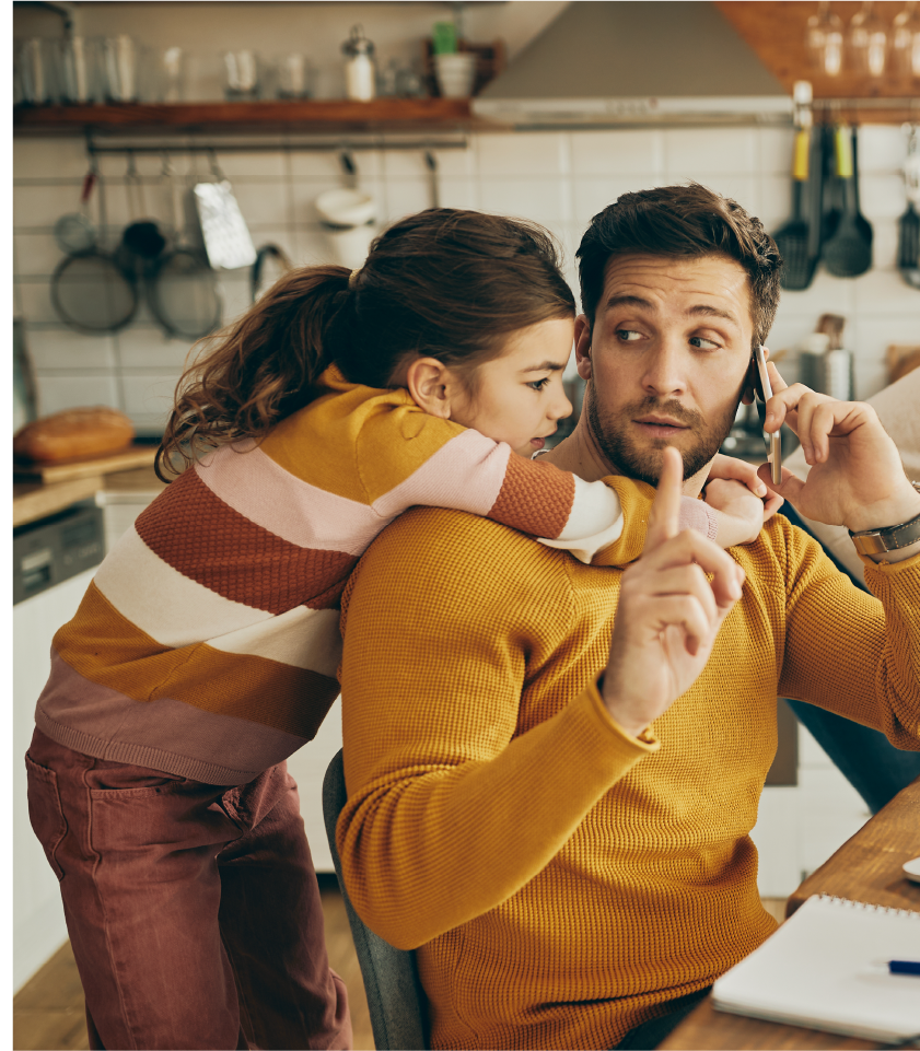 Busy parent managing work and family life before using professional meal prep services.